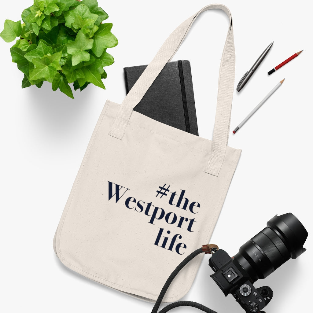 #thewestportlife Organic Canvas Tote Bag Do you live the #thewestportlife? Living the #thewestportlife is a lifestyle and proudly show it off the world that your beach of choice is Compo Beach and you support the local lifestyle. Free USA shipping on all products. Proceeds of this collection goes to help grow Finding Westport and Finding Connecticut’s brand.