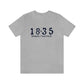 1835 Small Minuteman Unisex Jersey Short Sleeve Tee