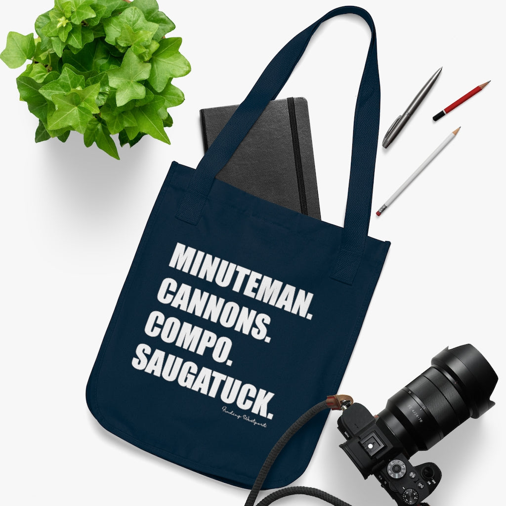 Minuteman. Cannons. Compo. Saugatuck. Organic Canvas Tote Bag  How do you say Westport without saying Westport? Westport, Connecticut is filled with unique aspects. Each providing different elements that make up the town from historic to modern traditions. Minuteman. Cannons. Compo. Saugatuck. You know its Westport.   Proceeds of this collection goes to help build Finding Westport and Finding Connecticut's  brands. 