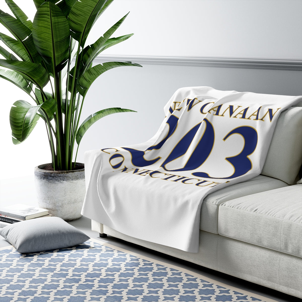 203 New Canaan Sherpa Fleece Blanket   The 203 New Canaan Collection. Show off New Canaan and Connecticut at the same time. Colors were inspired by the Connecticut state flag.   Proceeds help build Finding New Canaan and Finding Connecticut's brand. 